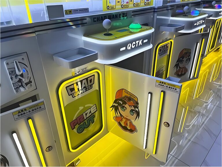 Close-up of joystick console, start button and prize outlet on the Chao Wan E Zu machine.