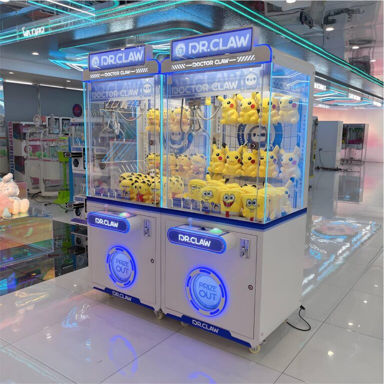 Three-quarter angled shot of two DR.CLAW arcade crane machines in a modern venue, joystick-and-button controls and bright LED lighting.