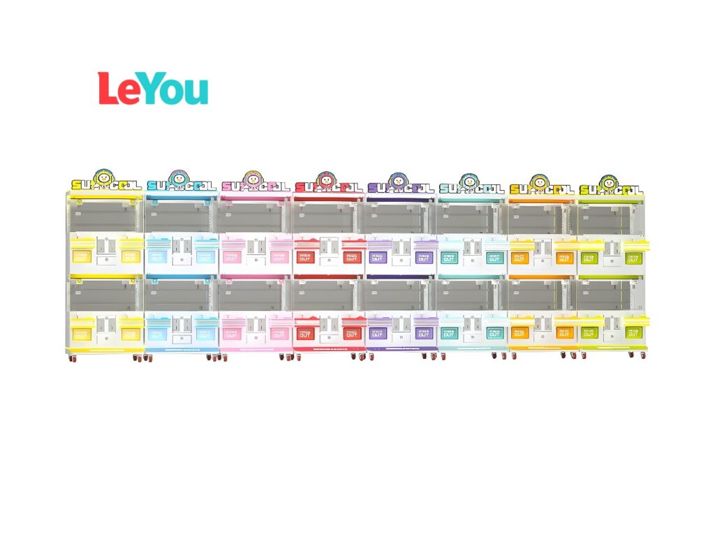LeYou brand: Eight colorful vending units in rainbow-striped cases, each with "SU-OCCL" mascot logo, layered product shelves behind glass doors, "PICK OUT" dispensers, and mobility casters on white background.
