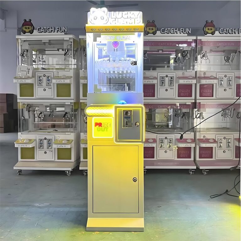 Yellow Lucky Clamp mini claw machine on showroom floor with LED button and edge lighting; compact footprint for counters.